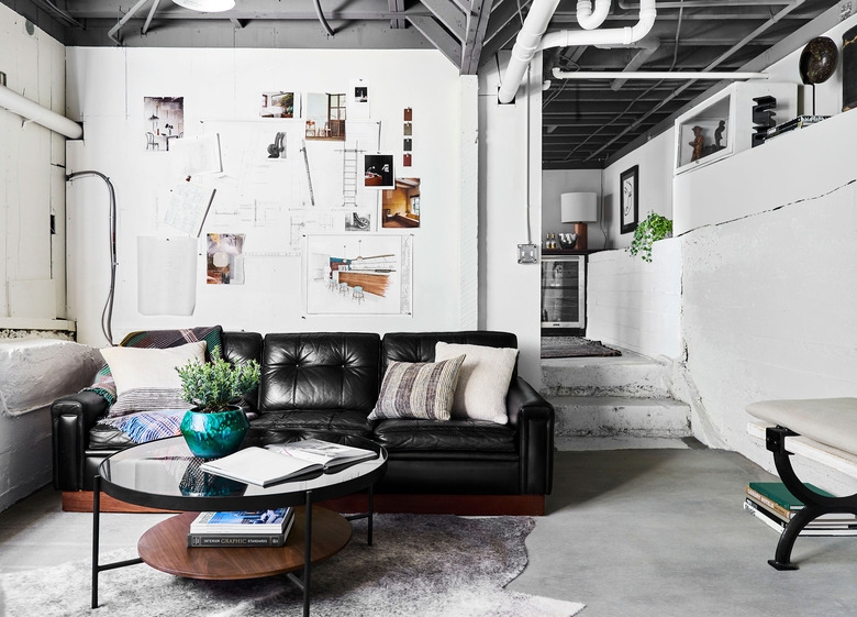 Tufted Sofa in Industrial Basement Lounge with Turquoise Accent Pop