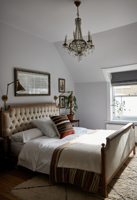 Tufted Wood Bed with Crystal Chandelier & Swing Arm Sconces