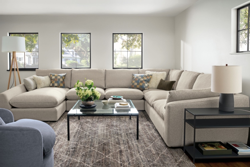 U-shaped Sectional Sofa Layout with Glass Coffee Table and Geometric Rug