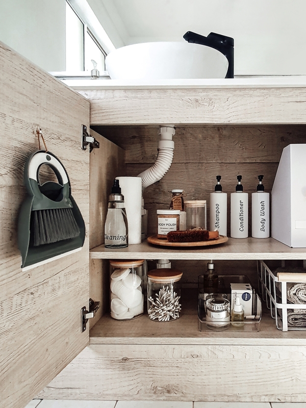 Under-Sink Cabinet Labeled Bottle Storage Solution with Tiered Shelving