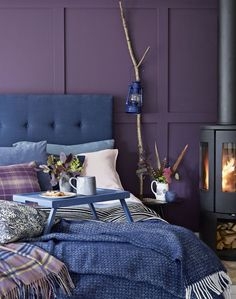 Upholstered Bed Blue Tufted Purple Paneled Walls Branch Lantern Decor