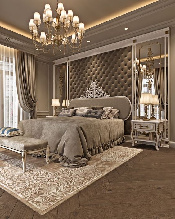 Upholstered Bed: Floor-to-Ceiling Tufted Wall & Ornate Chandelier