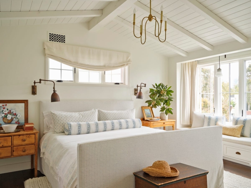 Upholstered Bed in Coastal Farmhouse Bedroom with Vaulted Beamed Ceiling