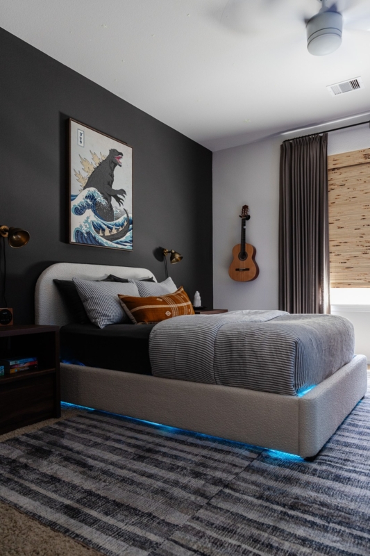 Upholstered Bed with Blue LED Under-Bed Lighting and Black Wall