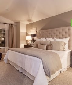 Upholstered Bed with Diamond Tufting in Cozy Sloped Ceiling Bedroom