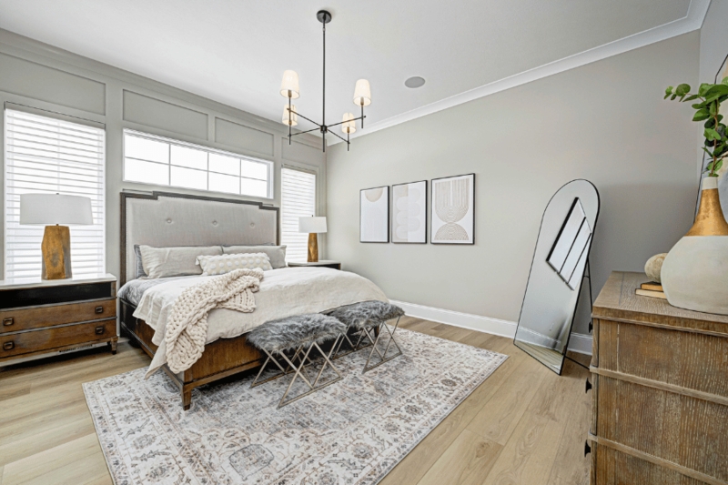 Upholstered Bed with Grid Wall Molding and Chunky Knit Throw
