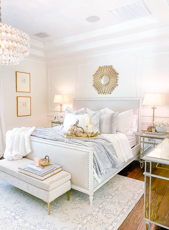 Upholstered Bed with Nailhead Trim and Gold Sunburst Mirror Styling
