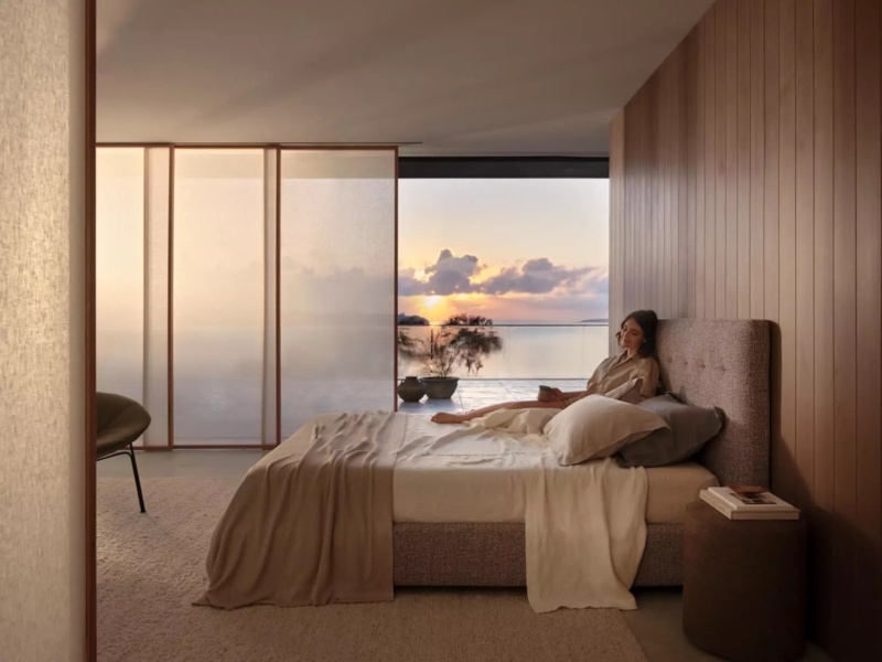 Upholstered Bed with Panoramic Ocean View and Tufted Headboard