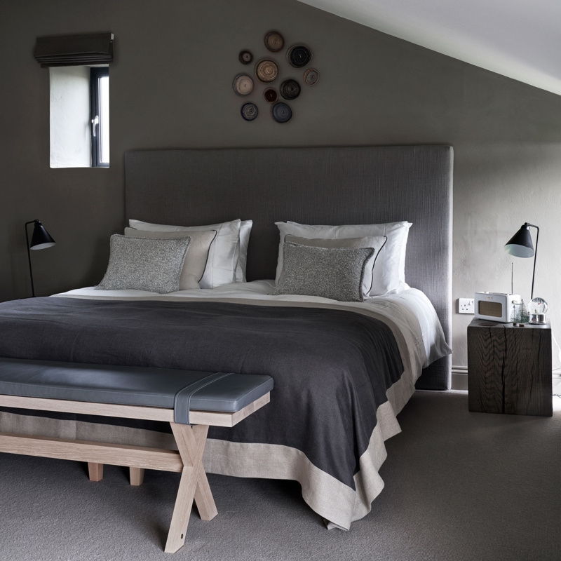 Upholstered Bed with Tall Headboard in Sloped Ceiling Layout