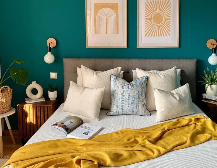 Upholstered Gray Headboard with Modern Globe Wall Sconces