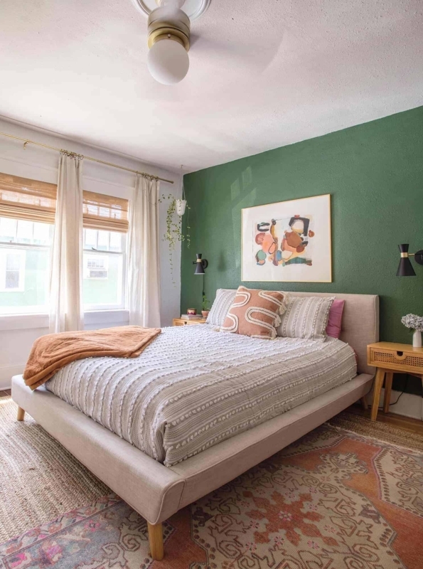 Upholstered Platform Bed in Boho Bedroom with Layered Rugs