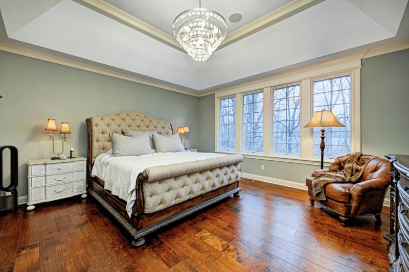 Upholstered Sleigh Bed with Diamond Tufting and Sage Green Walls