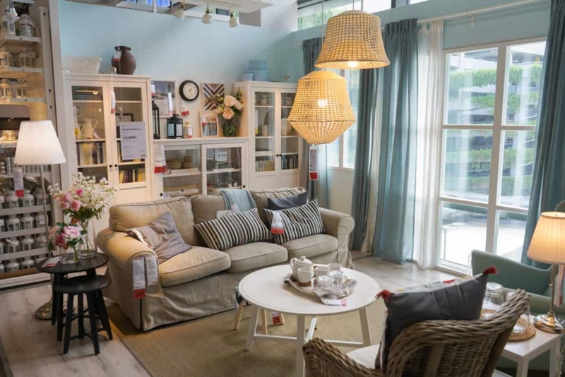 Upholstered Sofa in Airy Coastal Living Room with Woven Pendant Lights