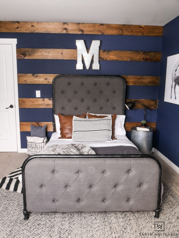 Upholstered Tufted Bed against Navy Blue Bedroom Accent Wall Planks