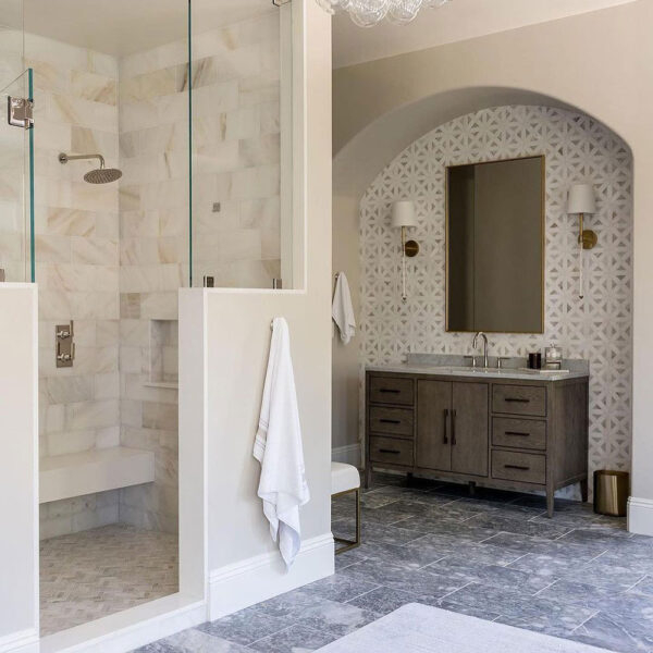 Upscale Bathroom With Arched Vanity Alcove And Geometric Backsplash Tile