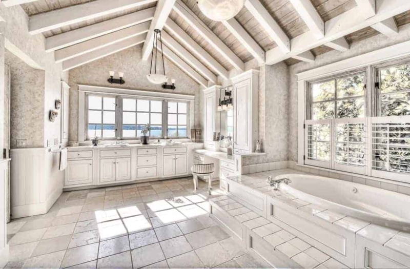 Vaulted Ceiling Bathroom Design with Tiled Tub Platform