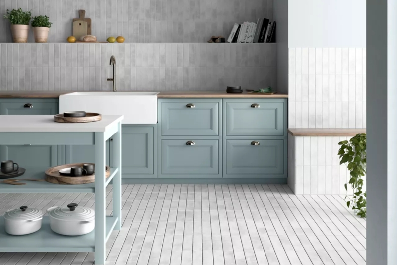 Vertical Stack Kitchen Tile Floor with Muted Blue Cabinets