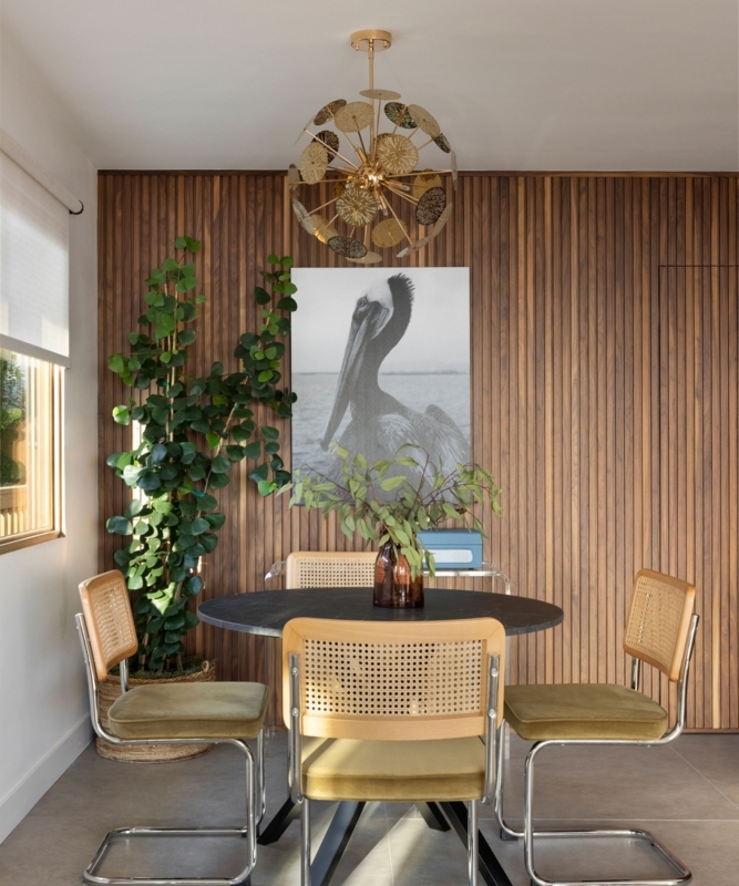 Vertical Wood Slat Accent Wall with Mid-Century Cantilever Chairs