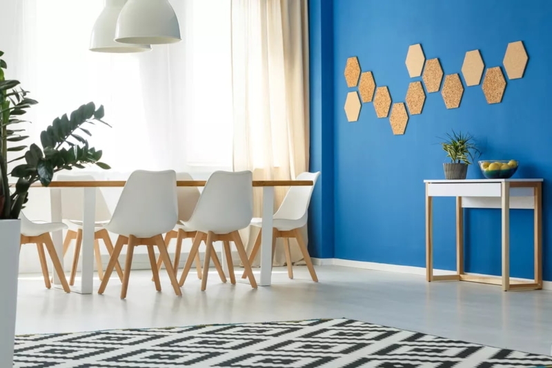 Vibrant Blue Accent Wall with Hexagonal Cork Board Wall Art