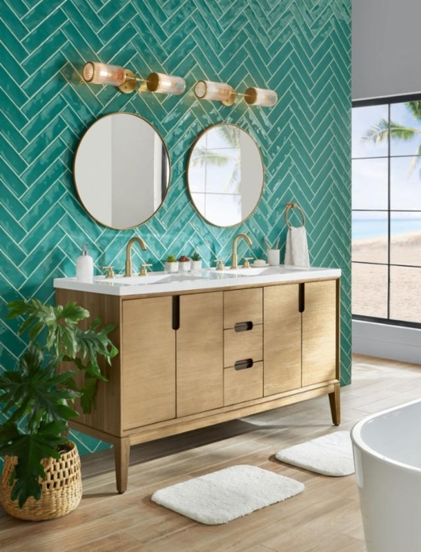 Vibrant Double Vanity with Teal Herringbone Tile Wall and Round Mirrors