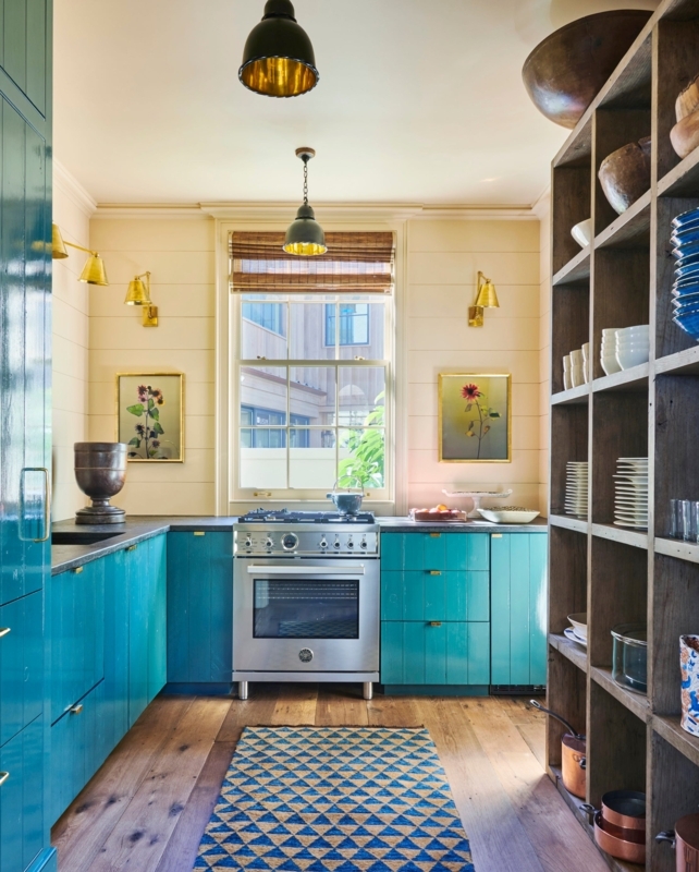 Vibrant Teal Kitchen Cabinetry with Floor-to-Ceiling Open Shelving