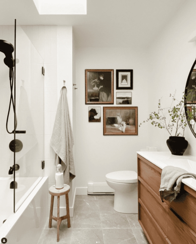 Vintage Gallery Wall in Minimalist Bathroom with Skylight Light