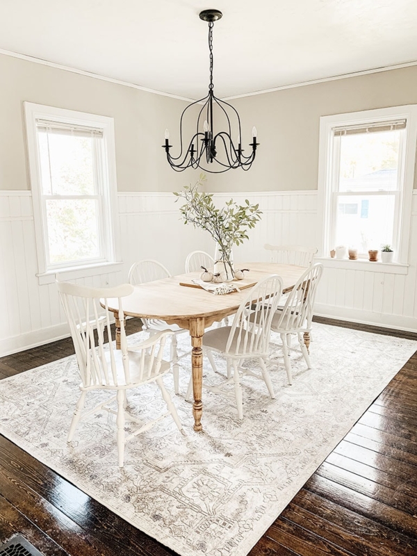 Vintage Inspired Area Rug under Oval Table and Spindle Chairs