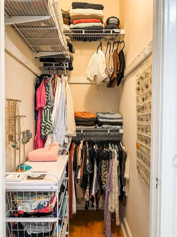 Walk-in Closet with Tiered Wire Shelving and Mobile Cart
