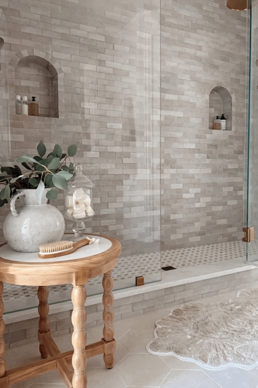 Walk-In Shower, Arched Niches, Wood Accent Table, Spa-Like Bathroom
