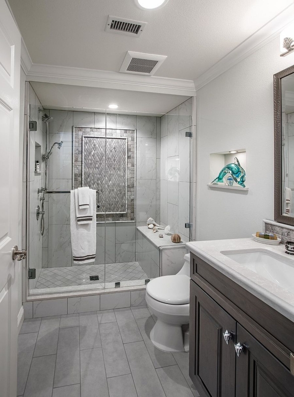 Walk-In Shower Design with Built-In Bench and Mosaic Niche