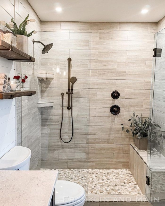 Walk-In Shower: Rustic Design with Pebble Floor & Bronze Fixtures