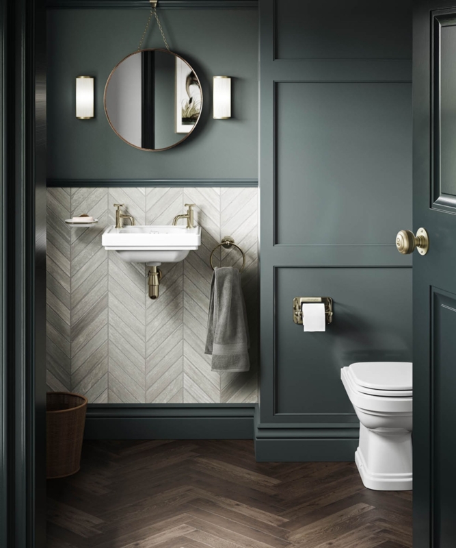 Wall Mounted Sink with Chevron Backsplash and Dark Green Paneling