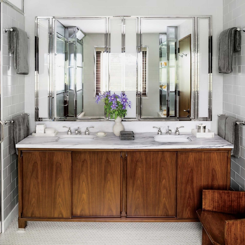 Walnut Double Vanity featuring a Three-Panel Mirrored Cabinet