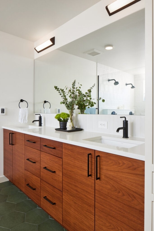Walnut Double Vanity with Green Hex Floor and Black Fixtures
