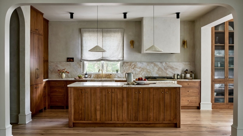 Warm Wood Kitchen Cabinets featuring a Reeded Island Base and Stone