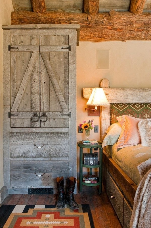 Weathered Grey Armoire in Lodge Bedroom with Heavy Log Beams