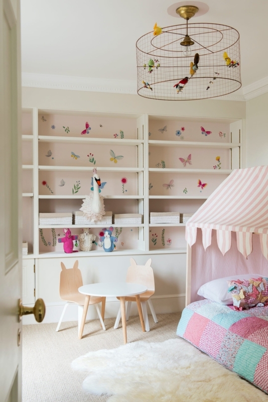 Whimsical Bedroom with a Birdcage Chandelier and Butterfly Shelving