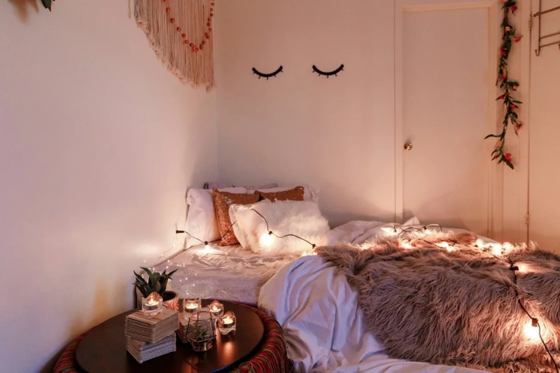 Whimsical Boho Bedroom Decor with Eyelash Wall Decals and String Lights