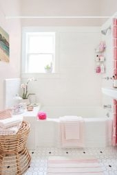 White and Pink Bathroom with woven rattan stool and grid shower curtain.