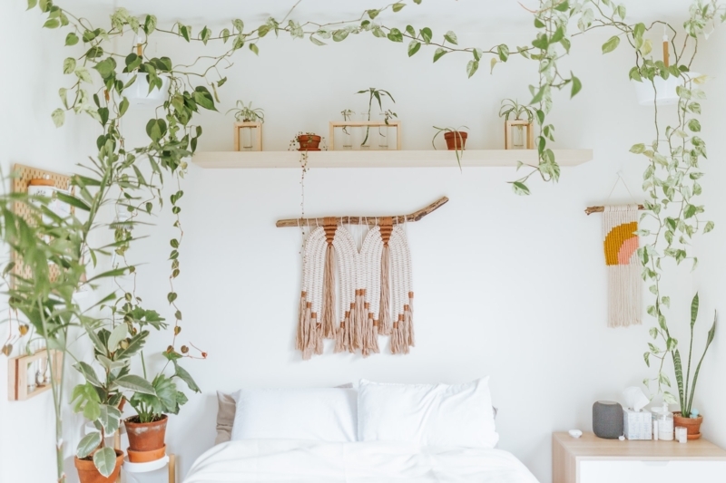 White Bed with Trailing Vines and Macrame Wall Art