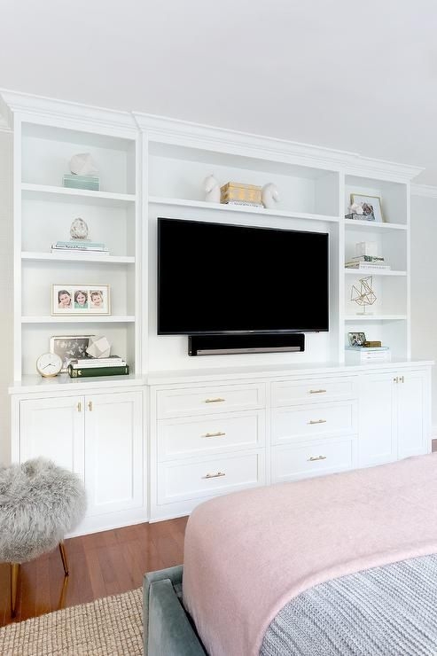 White Built-in Entertainment Center with Shaker Style and Gold Accents