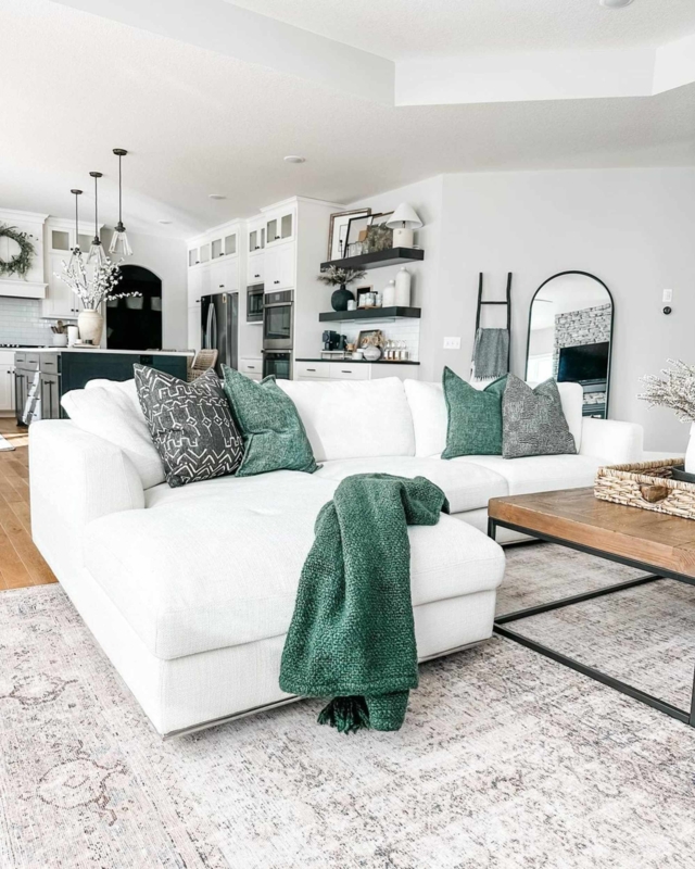 White Chaise Sectional Sofa with Forest Green Accents in Modern Farmhouse