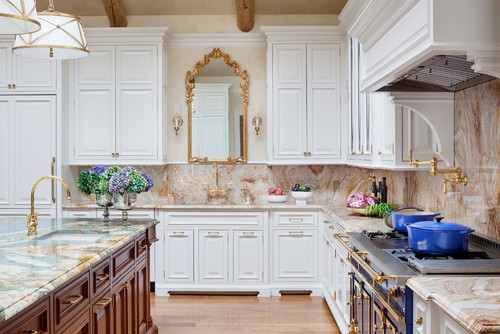 White Kitchen with Blue Professional Range and Ornate Gold Mirror