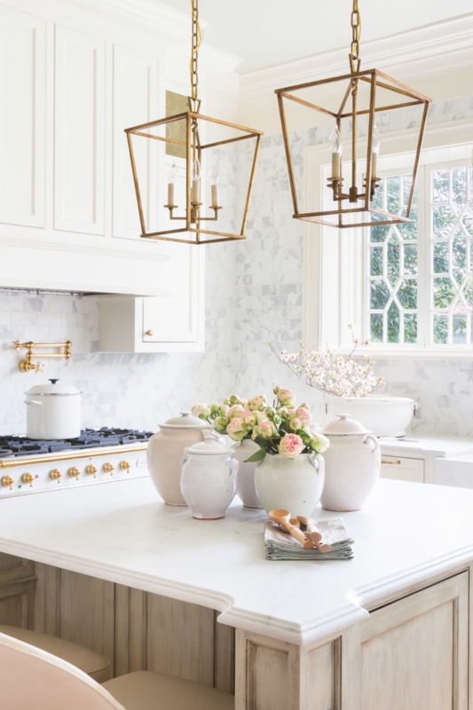 White Kitchen with Gold Lantern Pendants and Pot Filler