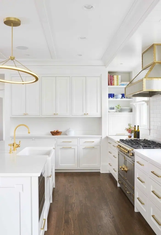 White Kitchen with Professional Charcoal Range and Gold Ring Pendant