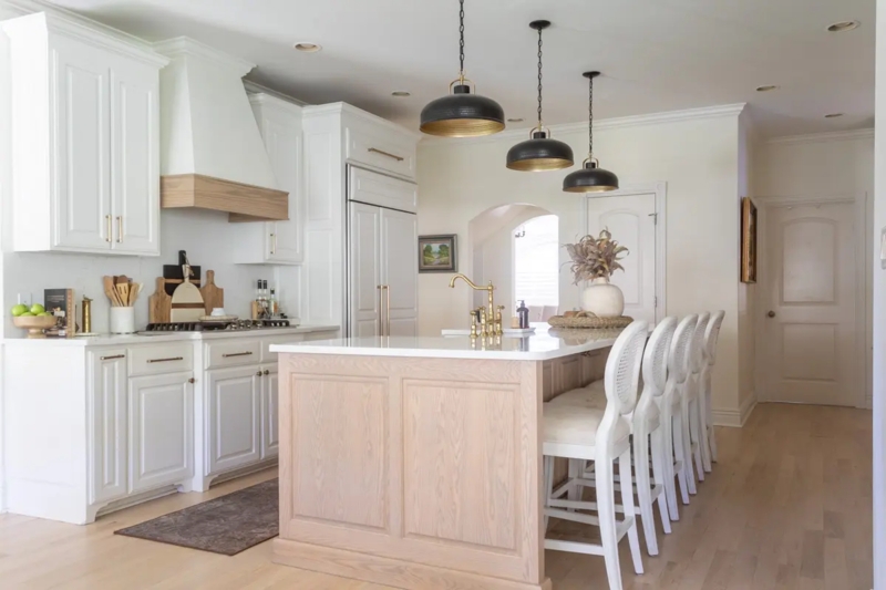 White Kitchen with Wood Island and Large Black Dome Pendant Lighting