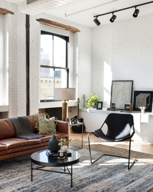 White Painted Brick Wall Industrial Living Room with Cognac Leather