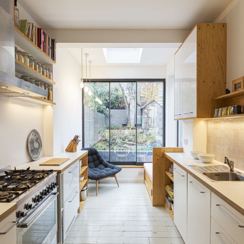 White Painted Kitchen Wood Floors in Scandinavian Galley Layout