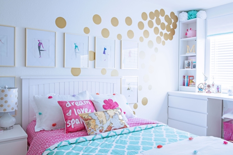 White Slatted Bed with Gold Polka Dot Decals and Vibrant Bedding