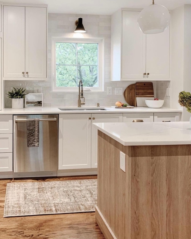 White Transitional Kitchen featuring Wood Island Base and Distressed Rug